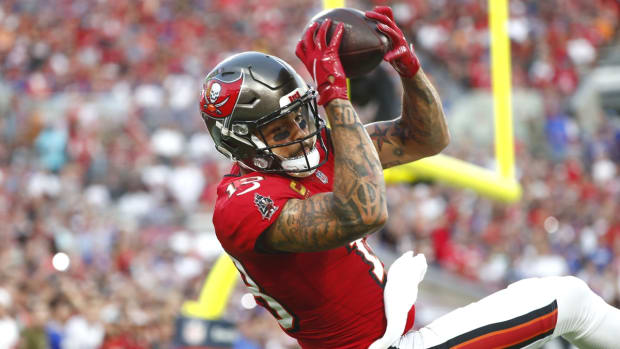 Dec 12, 2021; Tampa, Florida, USA; Tampa Bay Buccaneers wide receiver Mike Evans (13) catches the ball for a touchdown against the Buffalo Bills during the first half at Raymond James Stadium. Mandatory Credit: Kim Klement-USA TODAY Sports